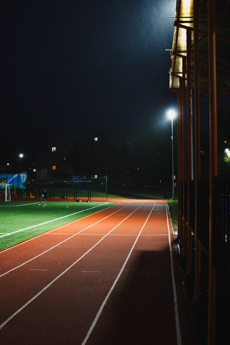 A night shot of a running track at a stadium