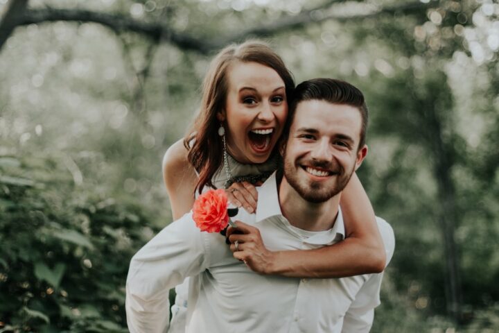 We were walking through a park with trails leading into the forests, when we saw this breathtaking coral flower… my sister ran and got it and jumped on her husbands back… right then and there is where is captured this priceless image.